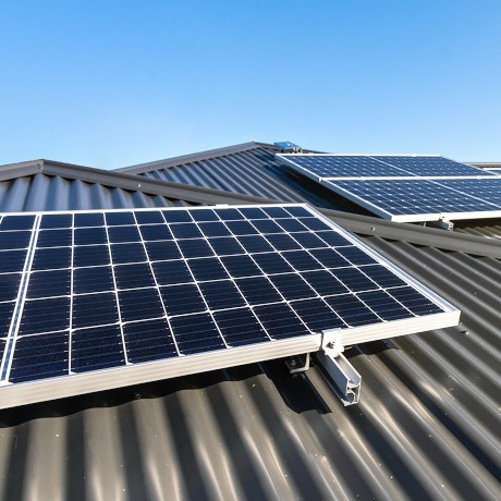 Solar panels on a modern home tin roof in Australia.