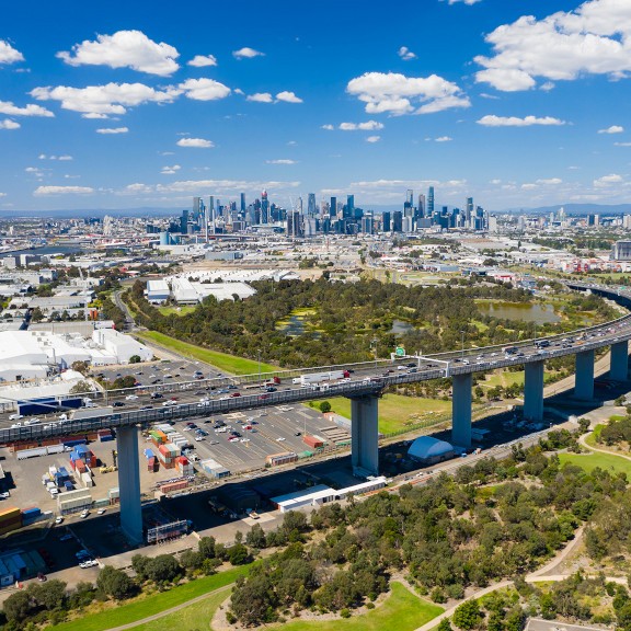 Melbourne city, freeway and large businesses from a distance.